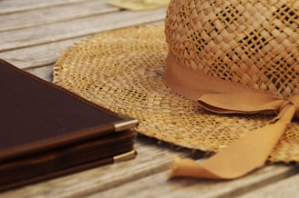 A close shot of a quill reserve hat resting on a wooden workbench.
