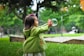 selective photo of a girl holding bubbles