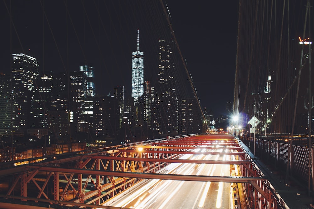 time-lapse photo of traffic lights and city buildings