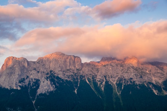 snowed mountain under white clouds photo in Dolomites Italy