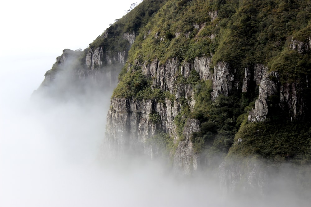 green mountain near cloudy sky