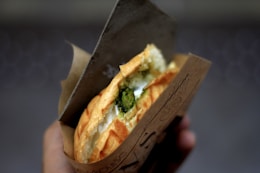selective focus photography of sandwich with fillings