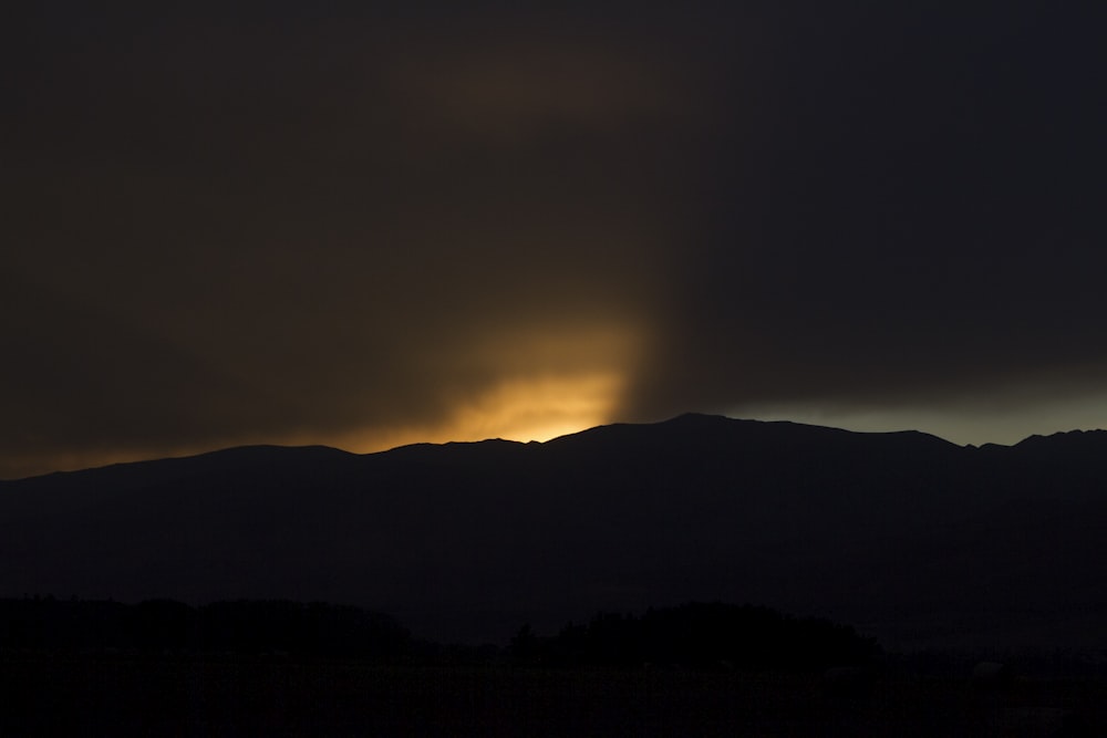 silhouette of mountain during sunset