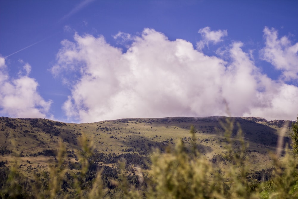 mountain near clouds