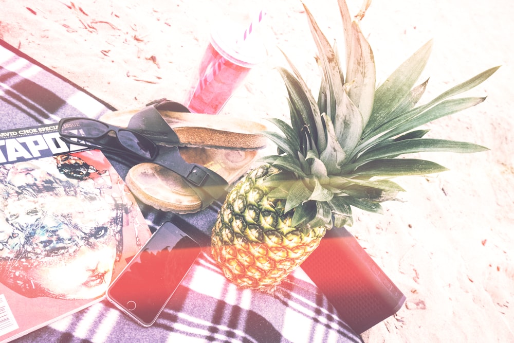 pineapple beside phone and speaker