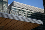Wide-angle view of the J2 Tower warehouse exterior with clear signage for Vaultara.