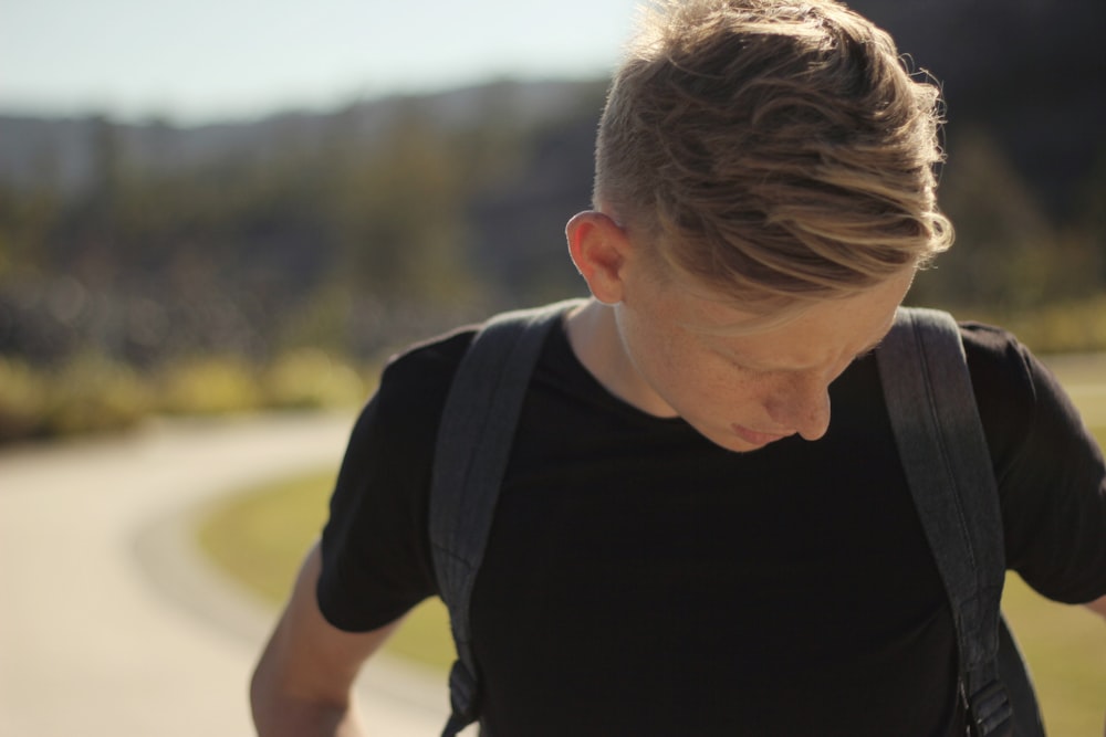 man carrying backpack