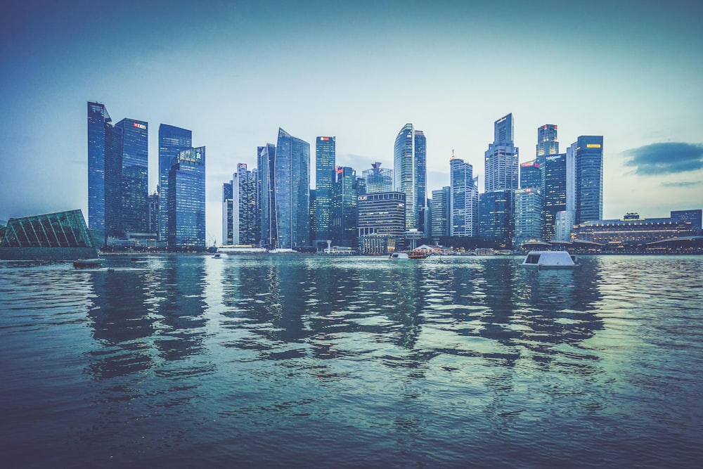 gray buildings near body of water at daytime