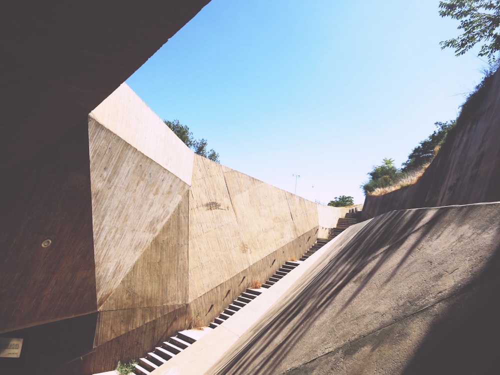 brown concrete stairs under bright sky