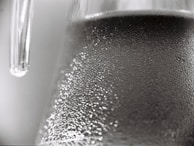 Close-up of sparkling clean glass surfaces reflecting natural light.