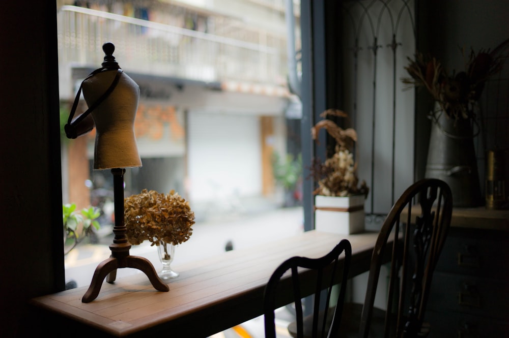 jewelry rack on brown wooden table