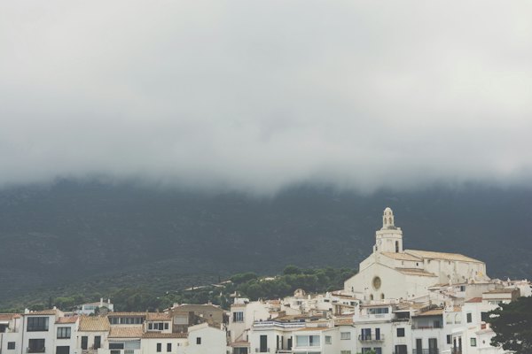 The white town under low cloud — Cadaqués, Spain