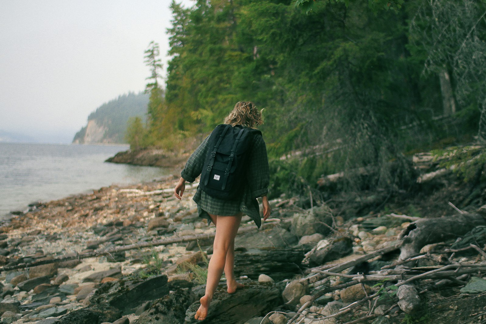 Sigma 30mm F1.4 EX DC HSM sample photo. Woman walking on rocky photography