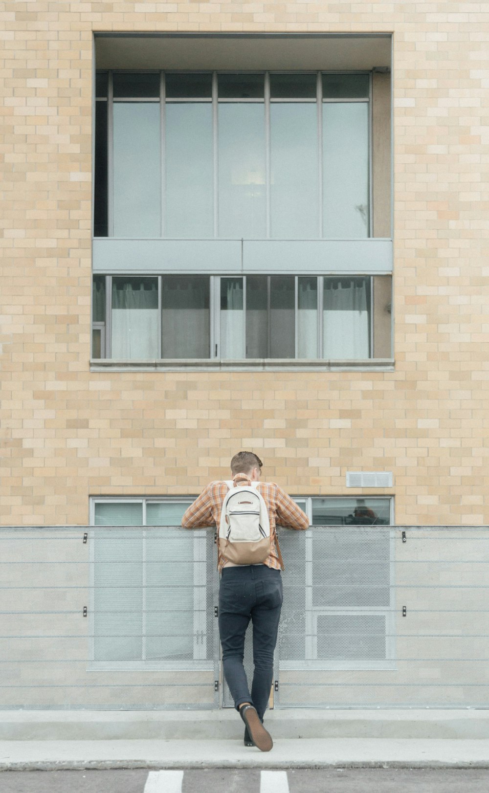 man standing in front of rail