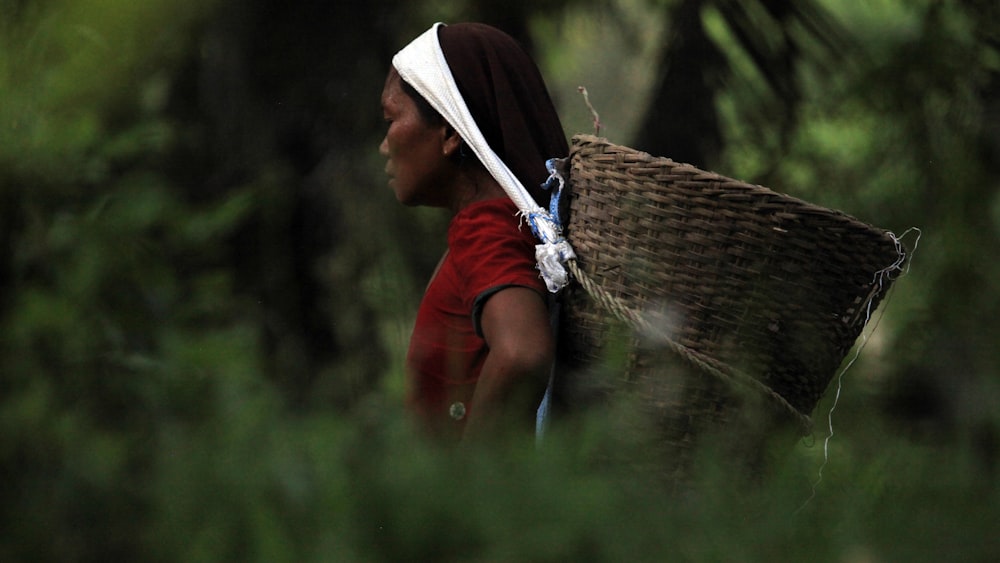 person carrying basket on her head