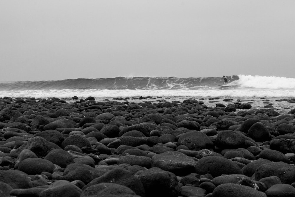 gray stones near the ocean waves