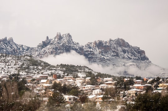 houses near mountain under white clouds in Vacarisas Spain