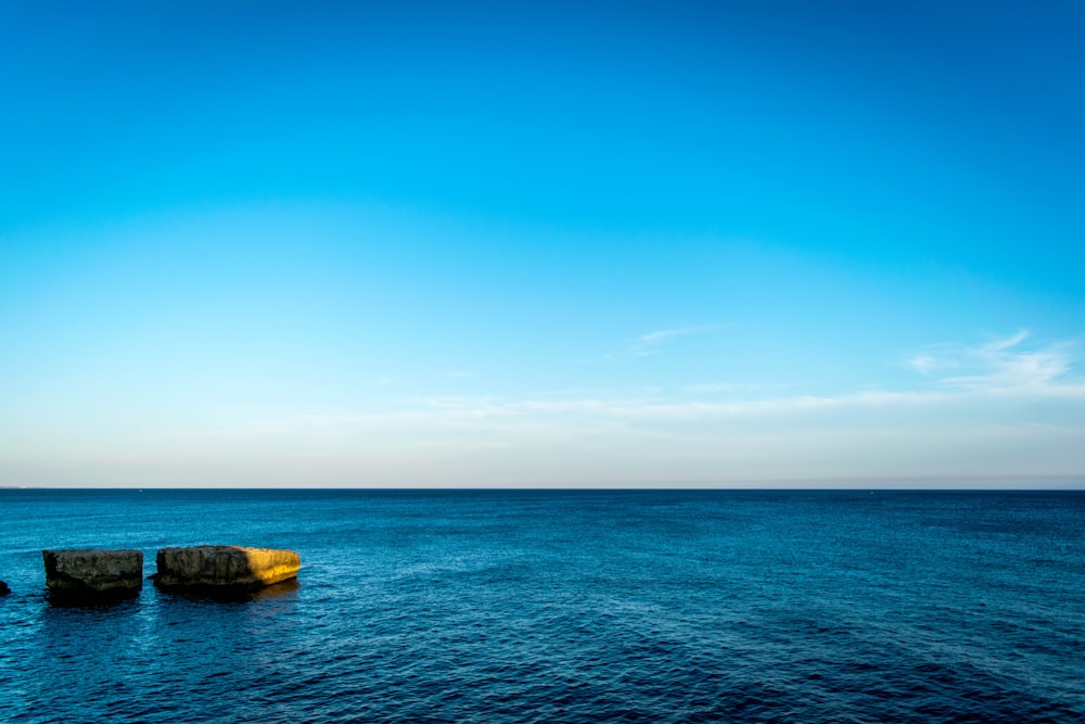 blue ocean water under blue sky