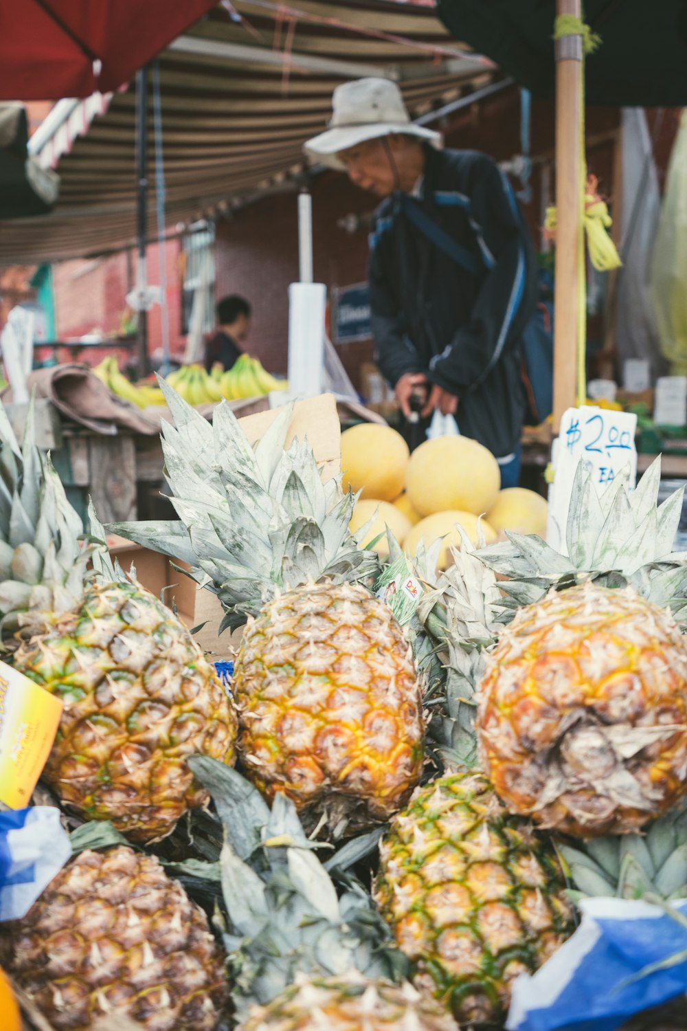 pile of displayed pineapple fruits