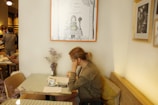 A picturesque view of Annika studying in a French café.