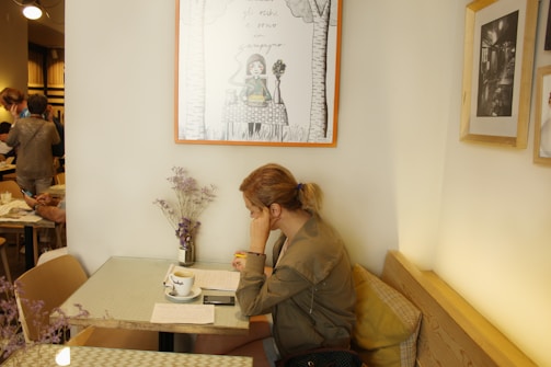 A picturesque view of Annika studying in a French café.