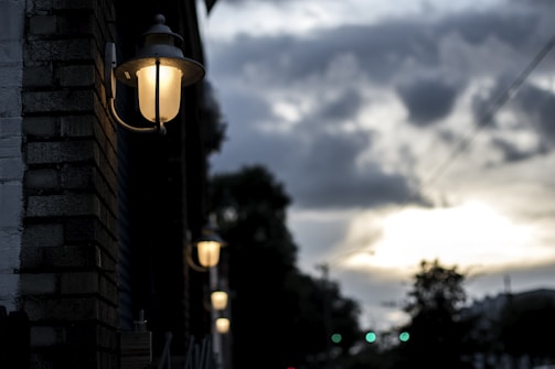 A cinematic still from a recent British indie film, capturing a moody London street scene at dusk.