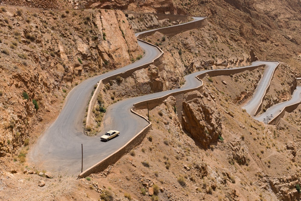 white car on winding road