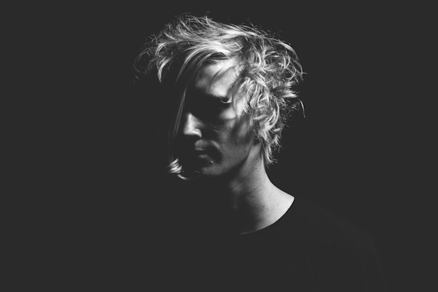man in black T-shirt in grayscale photography