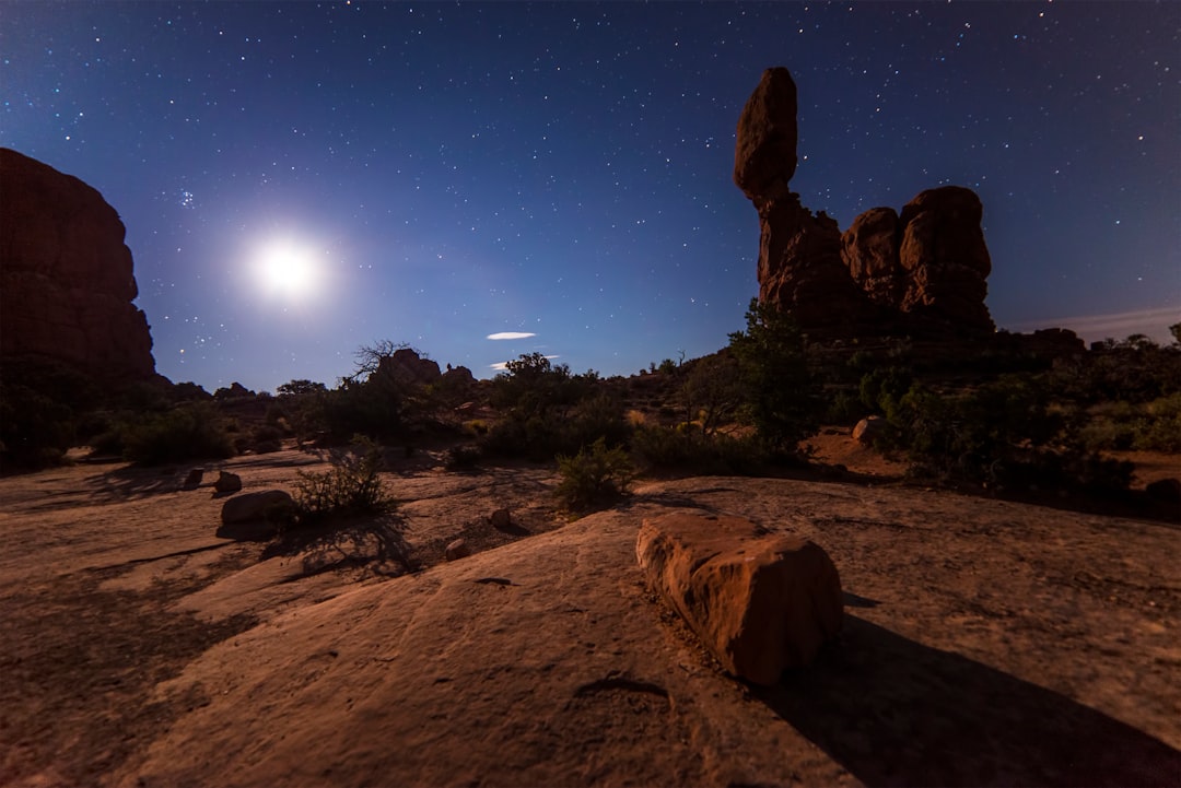 rock formation under starry skies