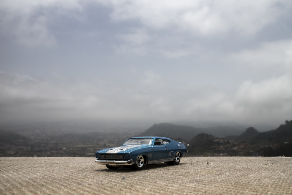 blue car on field