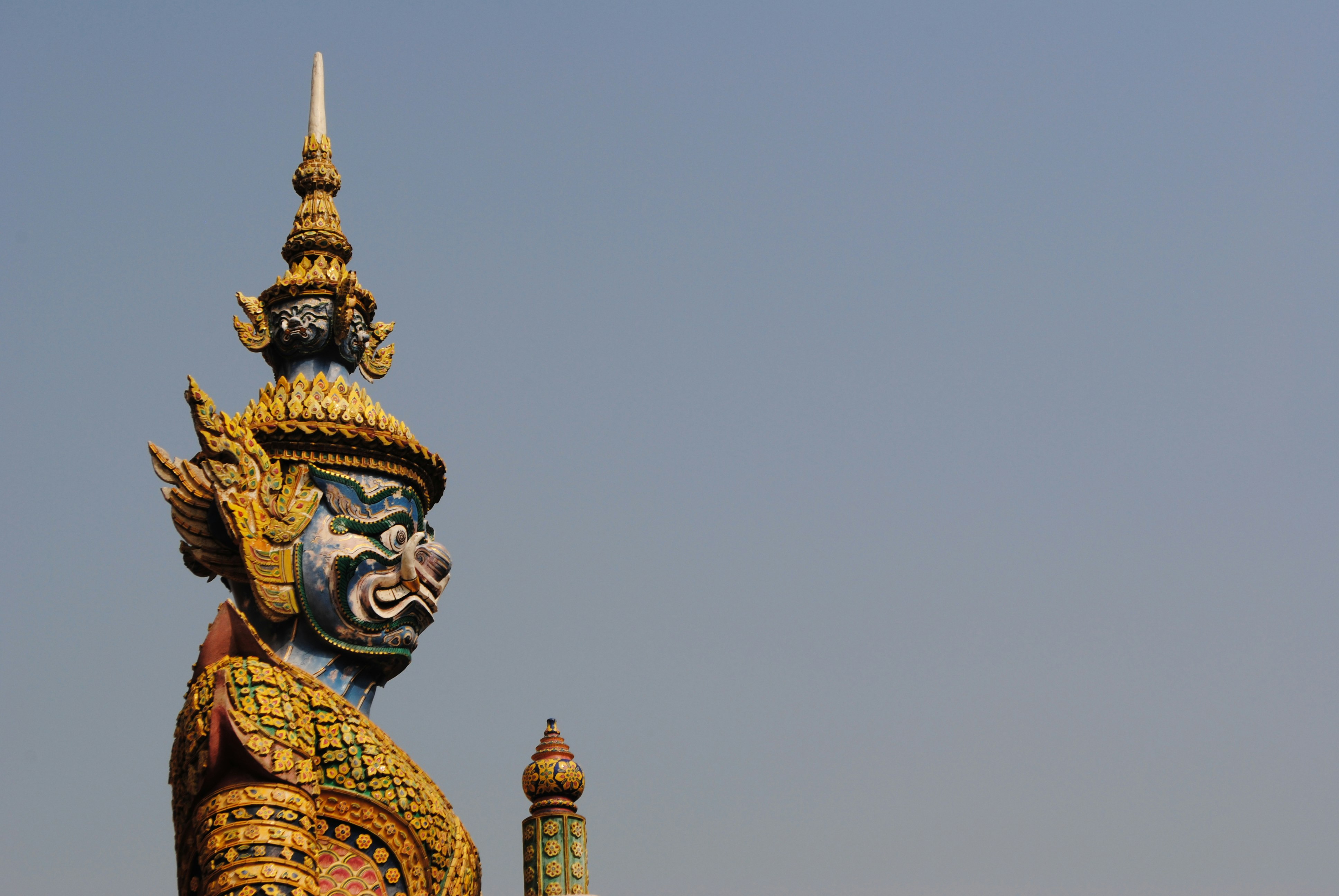 brown and blue Buddha statue