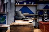 unpaired black and brown boot