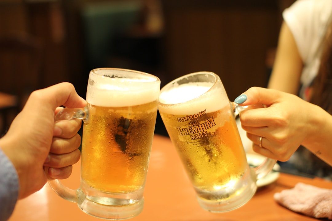 two mugs of brown liquids,