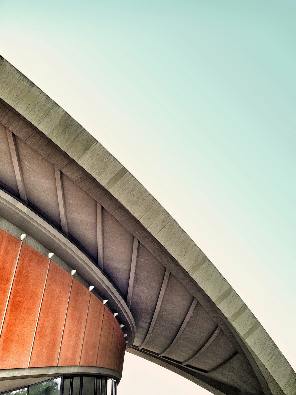 A concrete overhang in the roof of a round building