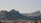 brown mountain with houses during daytime