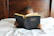 A father and two children reading abijah® faith-based books together at home.