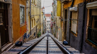 stairs in between colorful buildings