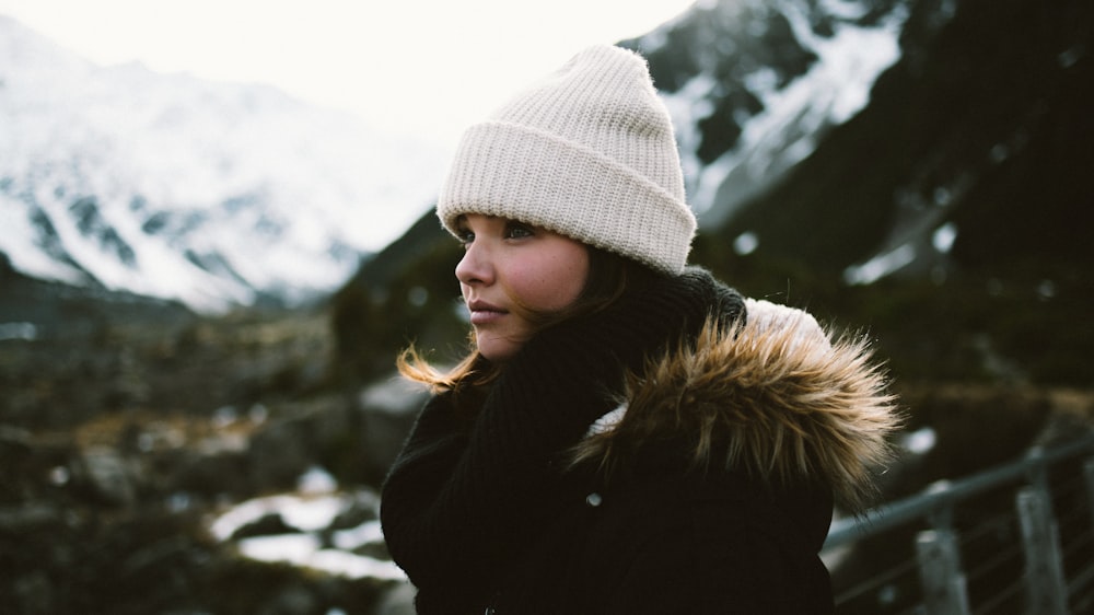 selective focus photography of woman wearing brown and black faux fur-lined coat