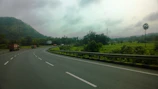 Rantailancar trucks driving on a highway surrounded by lush green landscape