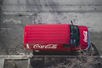 Aerial view of a water delivery truck on a road.