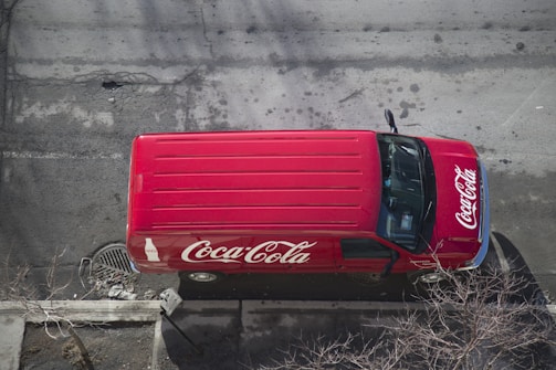 Aerial view of a water delivery truck on a road.