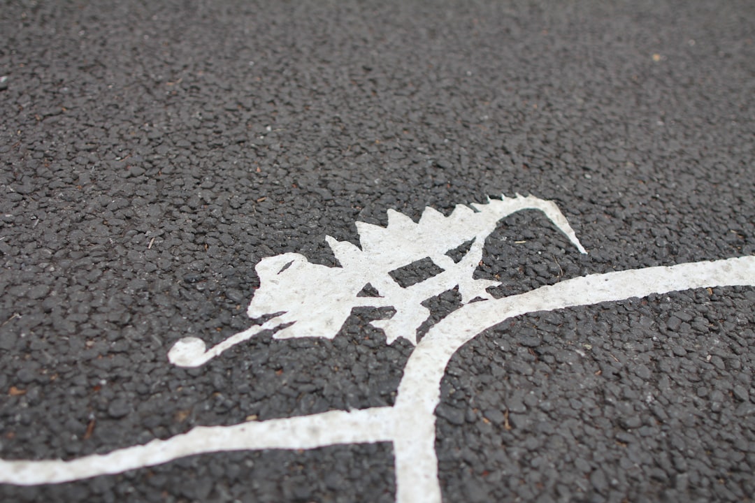 white lizard illustration on black floor