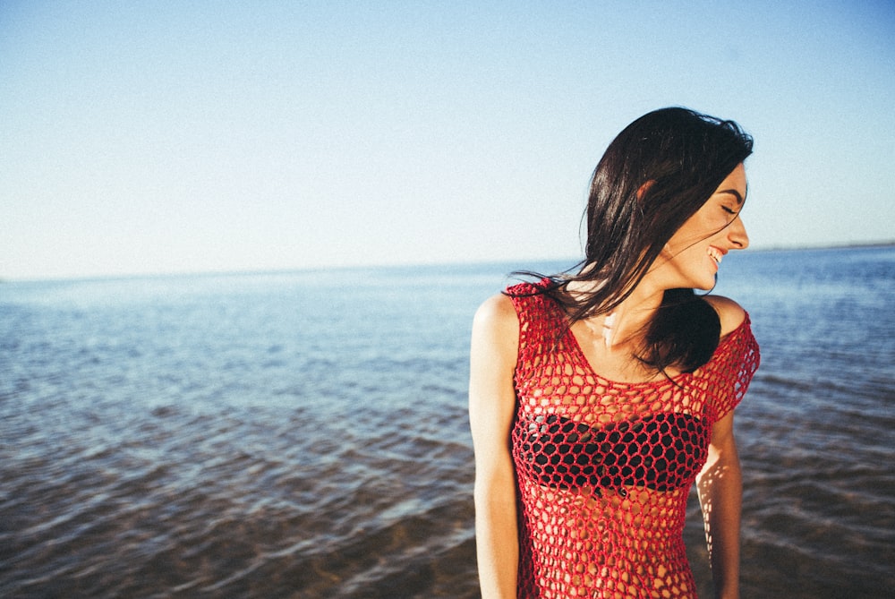 A happy woman on a beach in Hawaii.