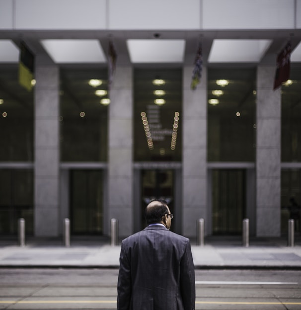 man standing in front of building