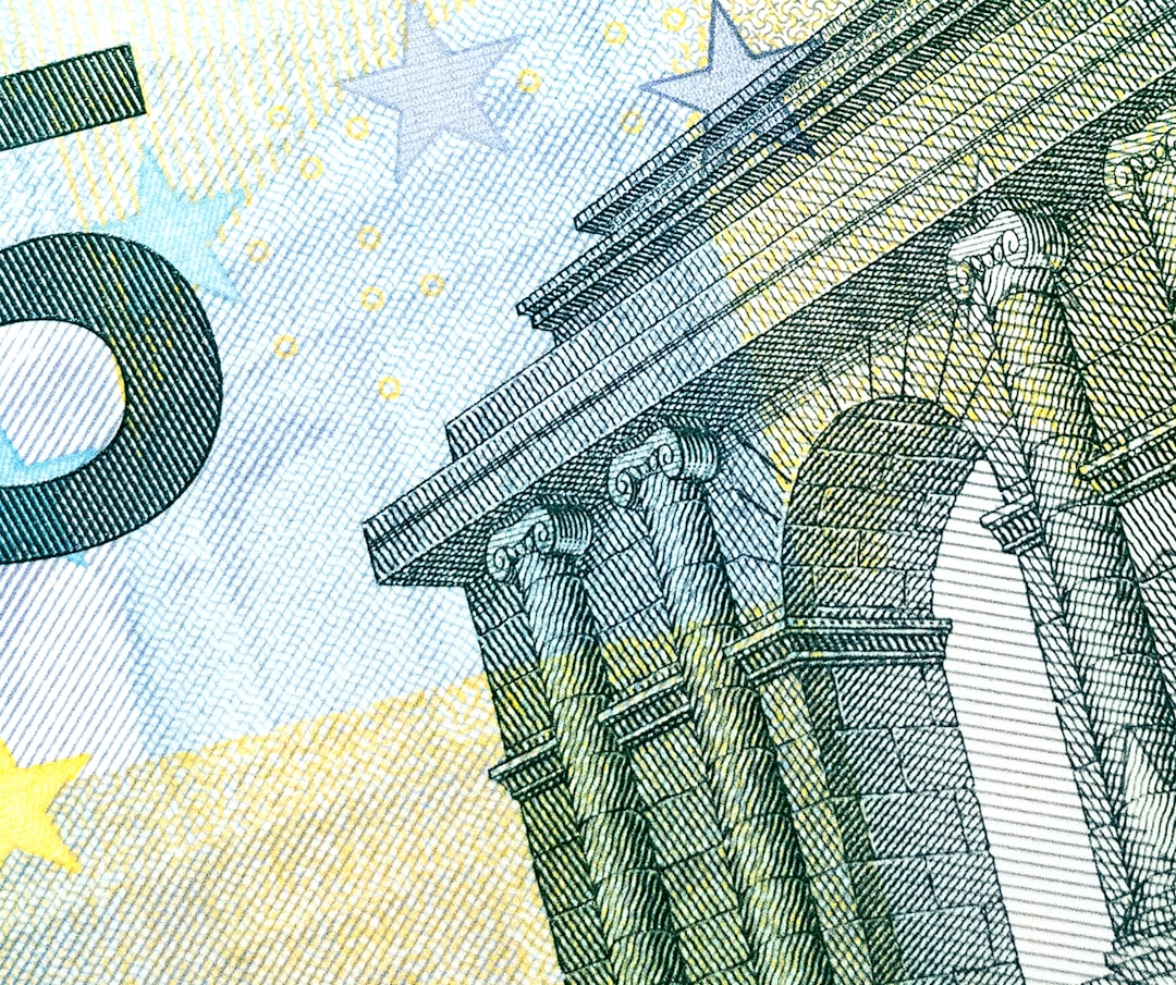 A detailed close-up of a classical building on a five euro note