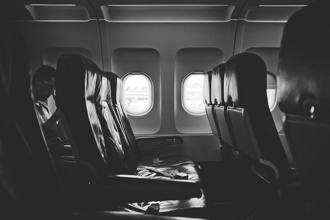 grayscale photo of airplane seats