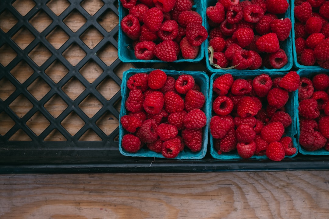bunch of strawberries in containers, Basket of raspberry