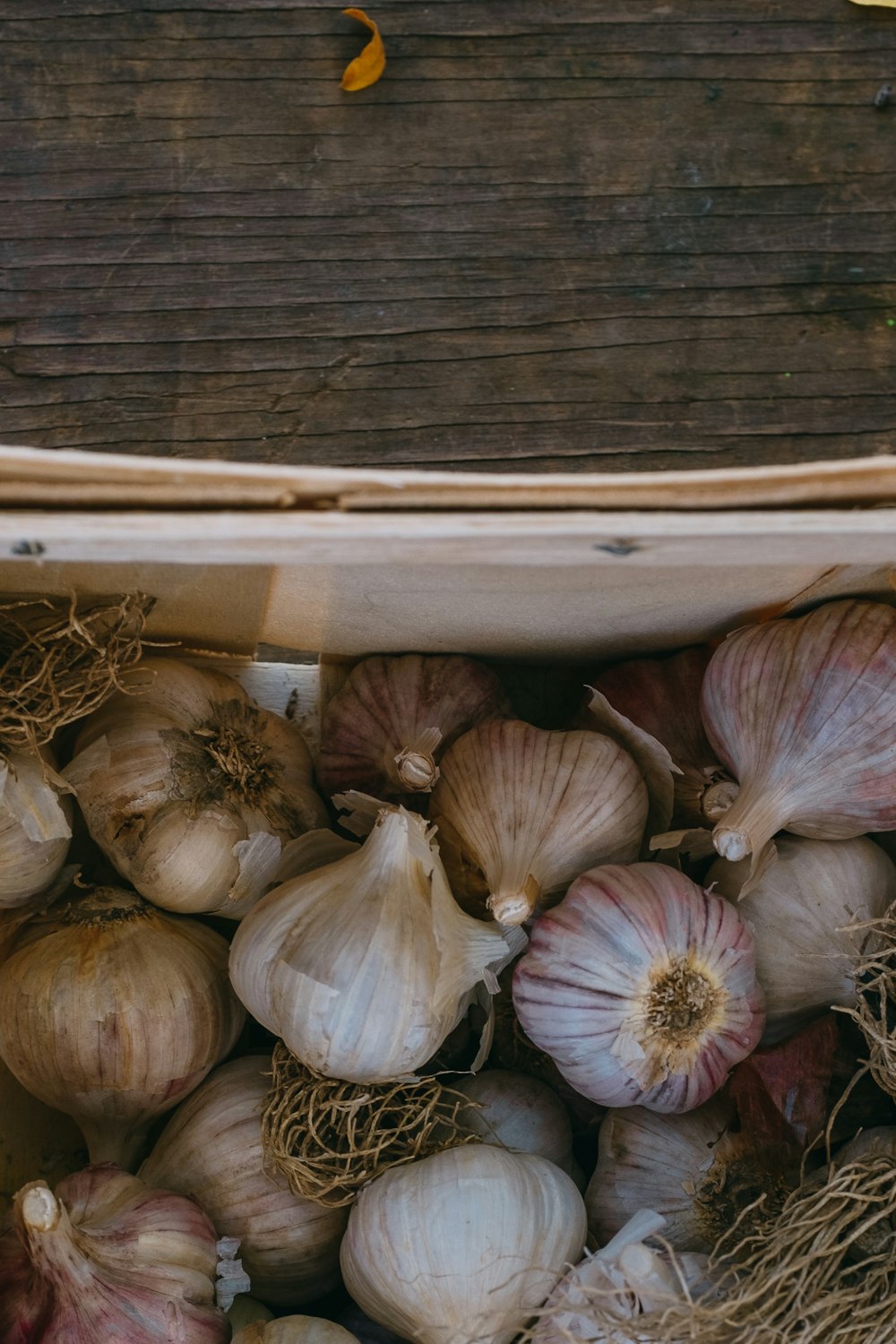 garlic on brown wooden table