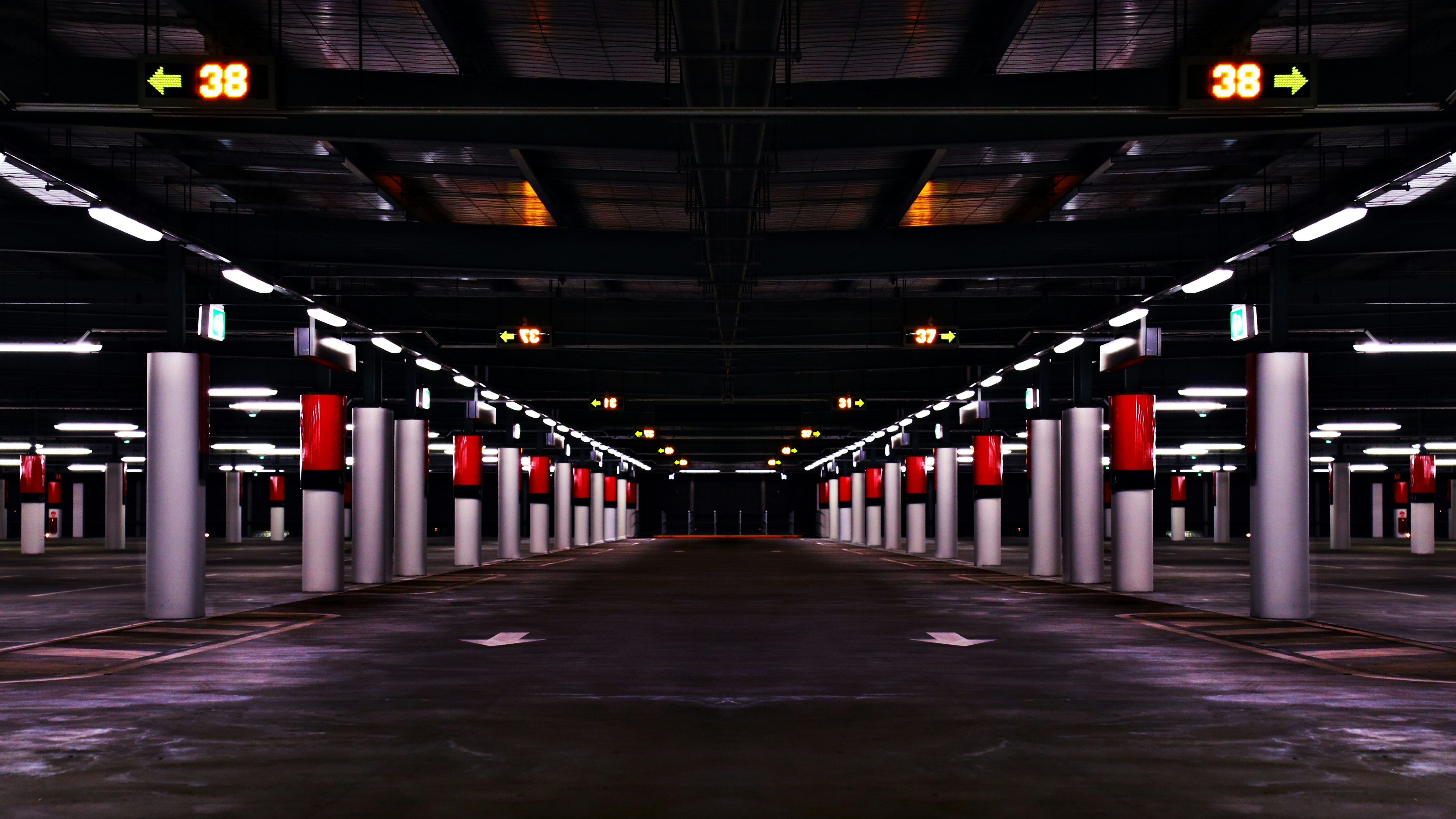 Columns form patterns and lines in an underground parking structure