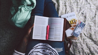 person holding unfold book